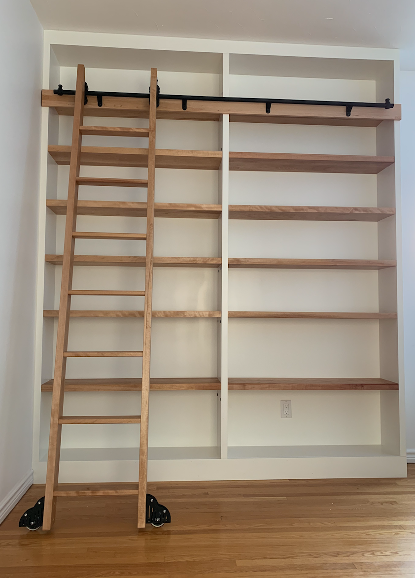 Custom library built-in with custom solid birch sliding ladder