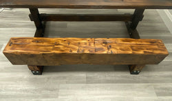 Reclaimed barn beam bench with black steel reinforcements