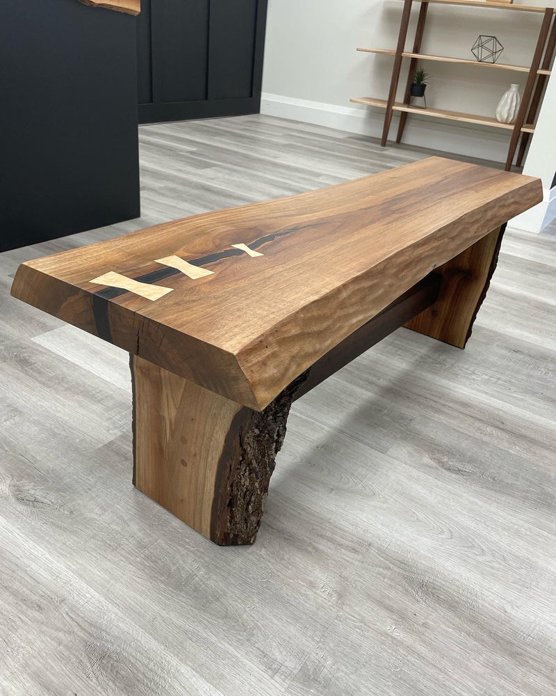 Solid black walnut bench with a live edge and maple bowties 