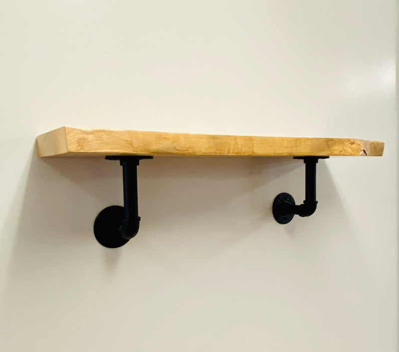 Natural edge, solid wood, shelf with black pipe brackets