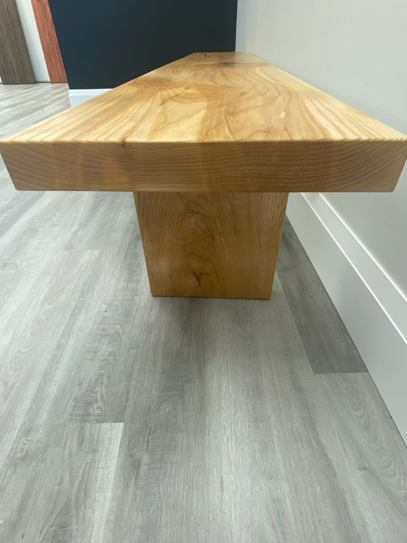 Side view of a solid white ash bench in a natural oil finish and removable legs