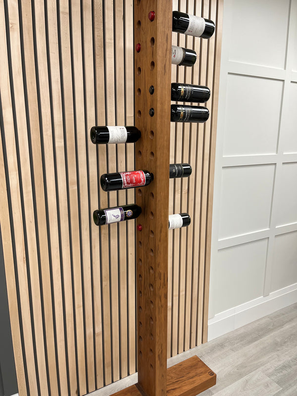Solid black cherry vertical wine rack with walnut accents. Shown with wine bottles.