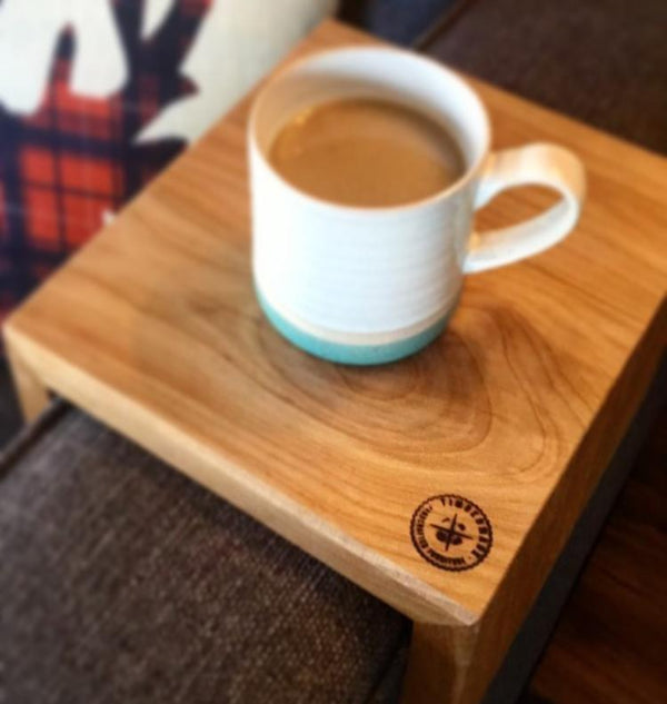 Wooden Couch Caddy On Armrest Of Couch With Coffee On It